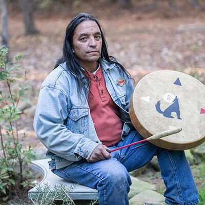 therapist Daniel Winkler practices playing drums as a traditional therapy tool