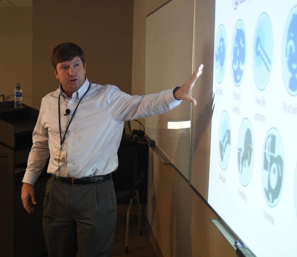 stephen pannell gives slide presentation during a lunch and learn at oxford